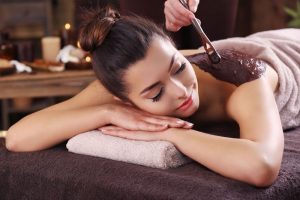 Women getting Chocolate Wrap Massage for Skin Smoothness and Glow